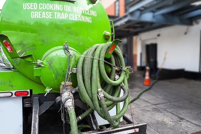 grease trap pumping truck with hose in Afton NY